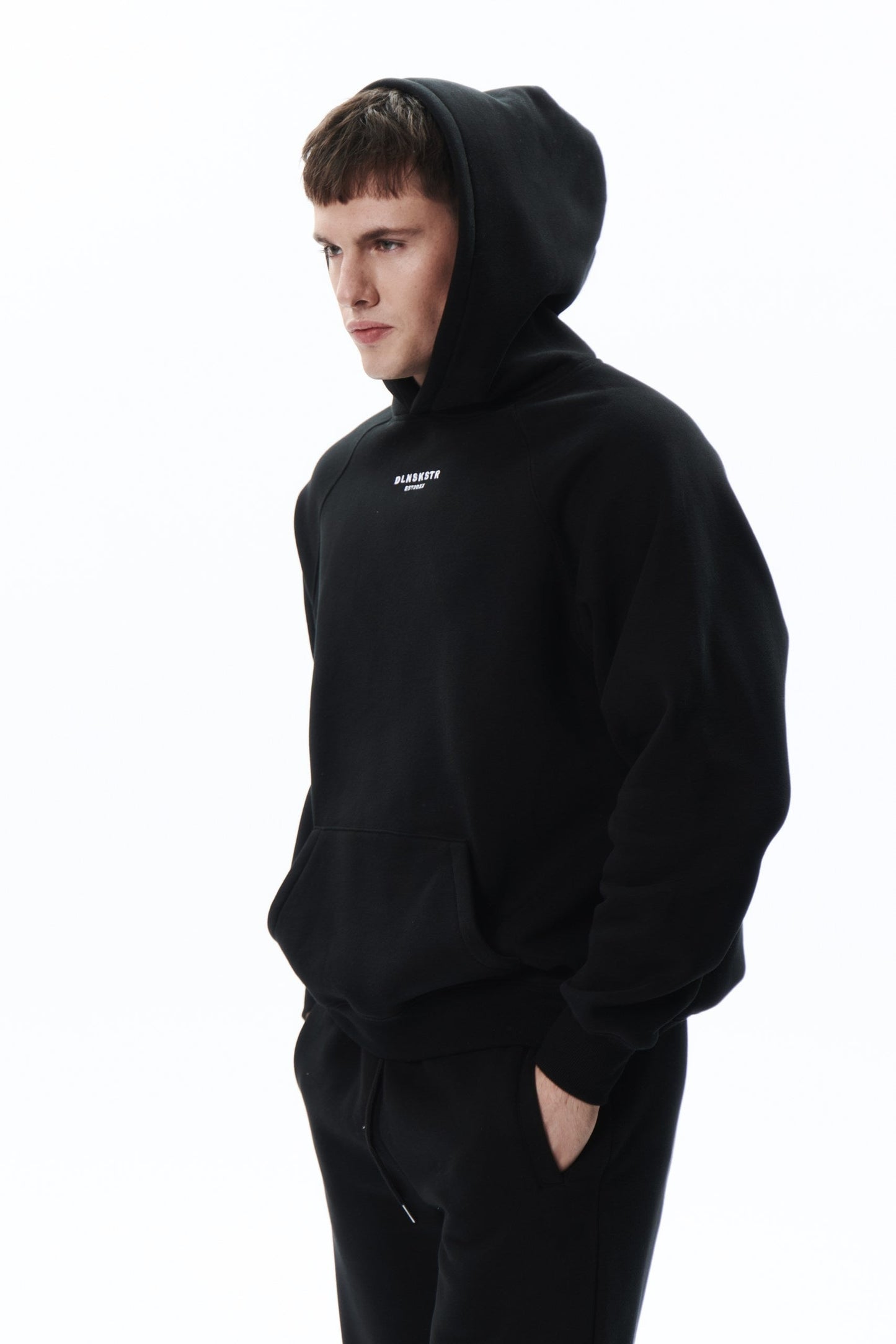 TRVL CLB base hoodie in BLACK DLNSK 